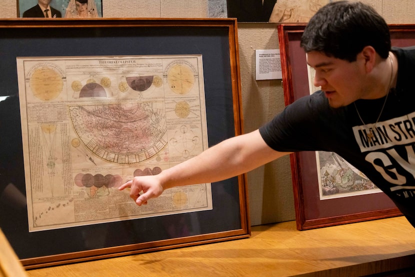 Aaron Mata, a junior exercise science student, points to astronomer Johann Gabriel...