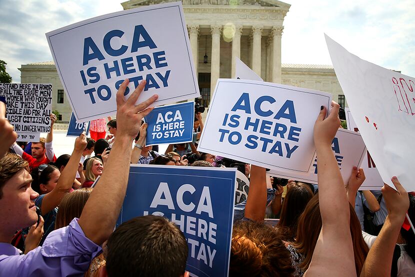  Demonstrators celebrate the U.S. Supreme Court's decision upholding the Affordable Care...