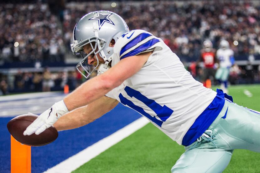 Dallas Cowboys wide receiver Cole Beasley (11) dives toward the goal line out of bounds...