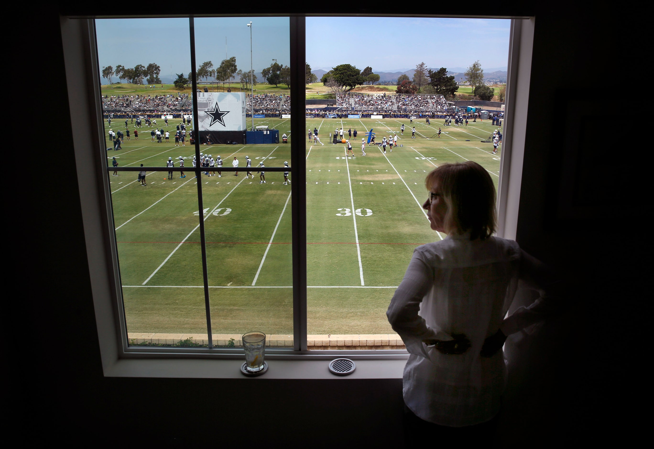 Homeowner Michelle Payne watched the Dallas Cowboys training camp opening ceremonies and...