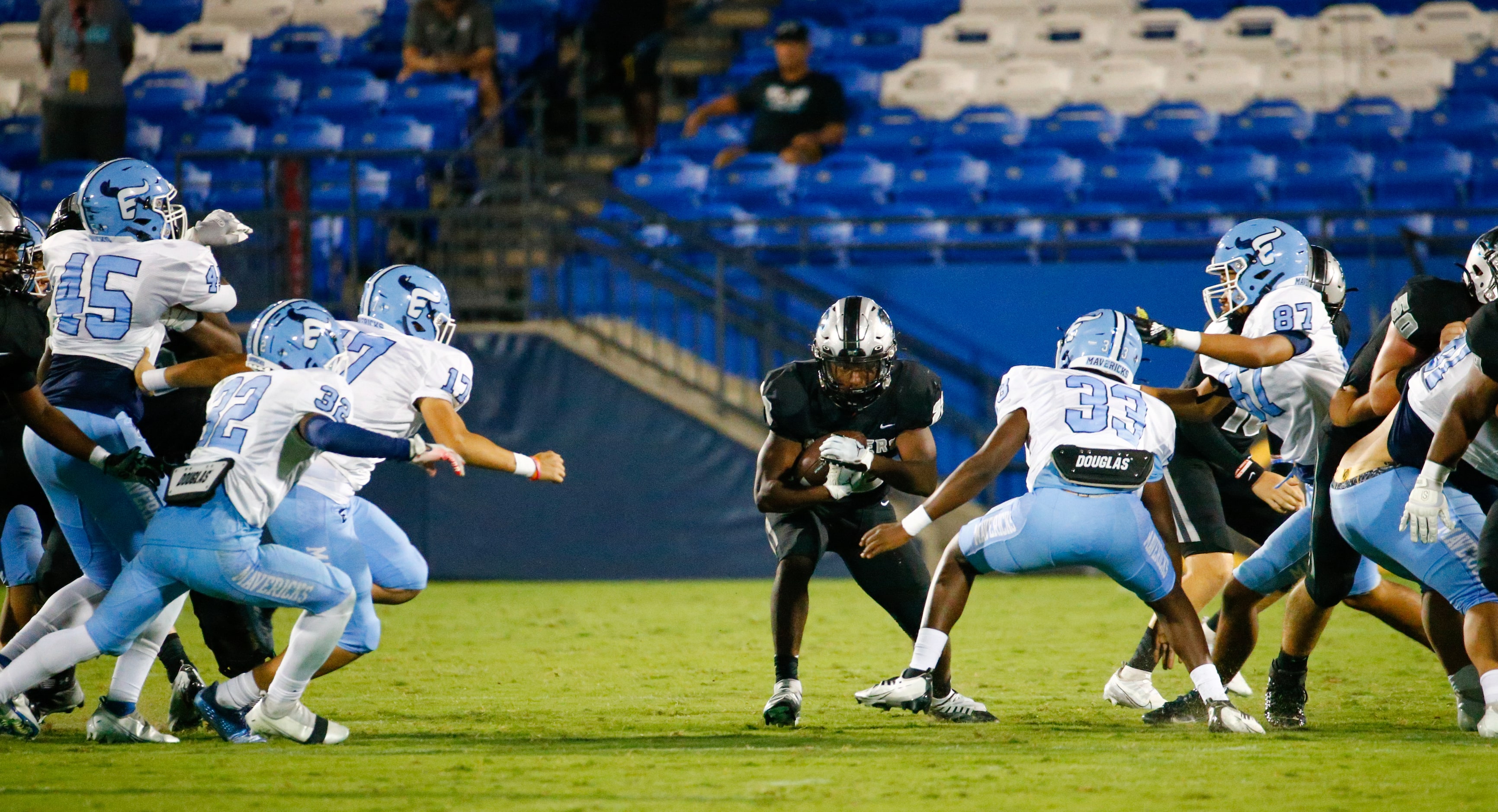 Panther Creek Panthers running back Gary Simms (22) prepares to dodge Emerson Mavericks...