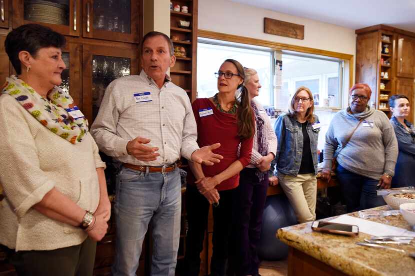 Pat Doyle (second from left) and his wife, Dianne (in red shirt), hosted a plant-based...