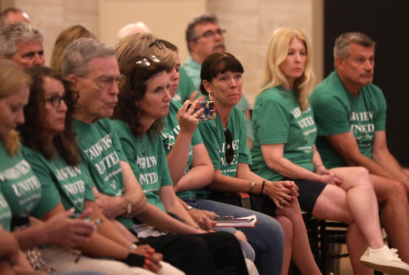 People at the Fairview Town Council meeting Tuesday night dressed in white shirts and green...