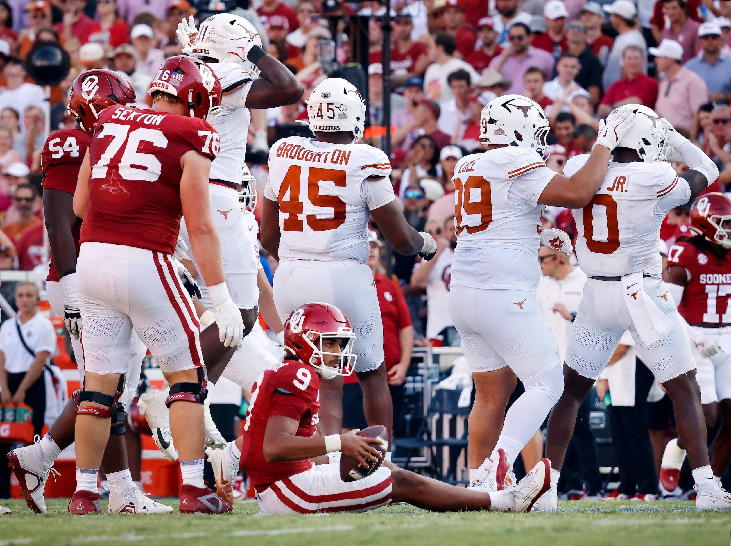 Oklahoma Sooners quarterback Michael Hawkins Jr. (9) sits on the turf after being sacked by...