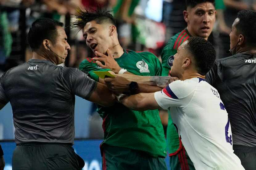 Sergino Dest of the United States pushes Gerardo Arteaga of Mexico during the second half of...