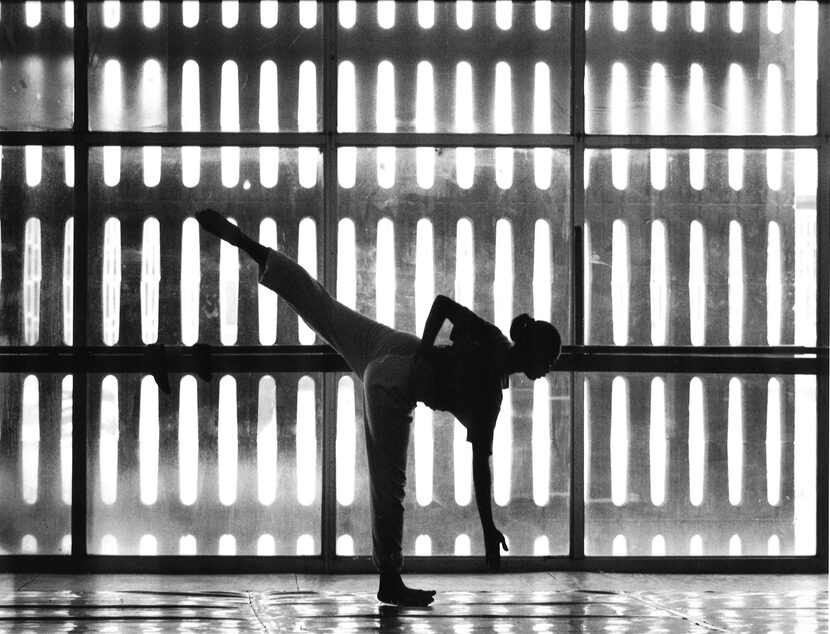 A dancer with the Dallas Black Dance Theatre stretching out before a rehearsal session in...