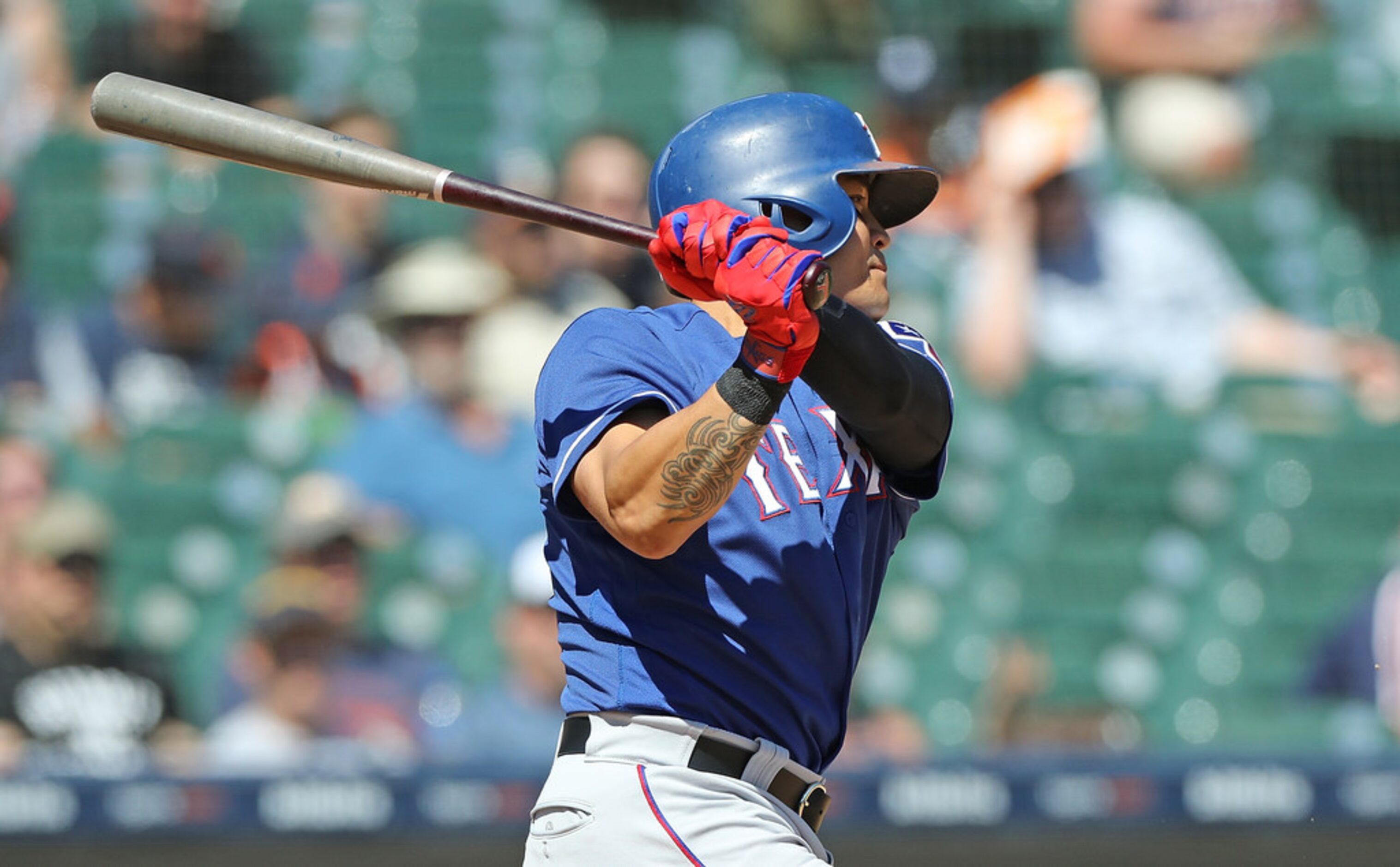 DETROIT, MI - JULY 8: Shin-Soo Choo #17 of the Texas Rangers hits an infield single during...