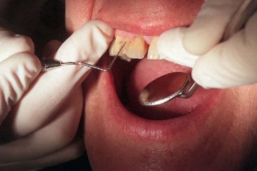 A patient with gum disease who recently had a heart attack is examined by Temple University...