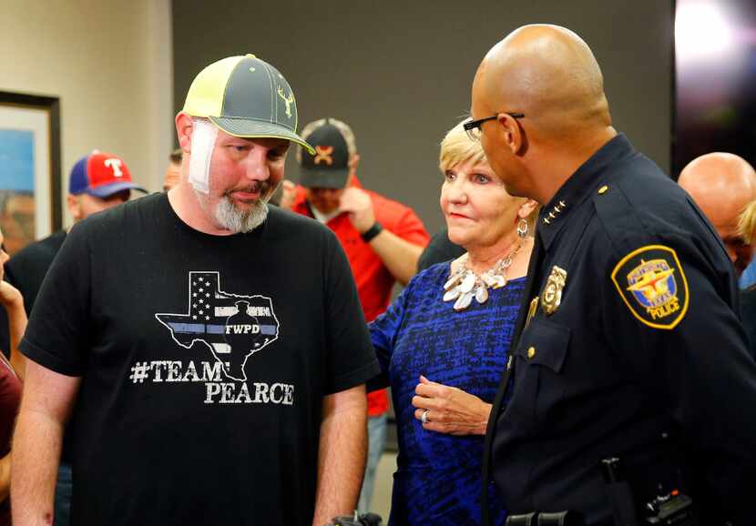 Fort Worth police Officer Matt Pearce (left), a shooting victim, came to John Peter Smith...