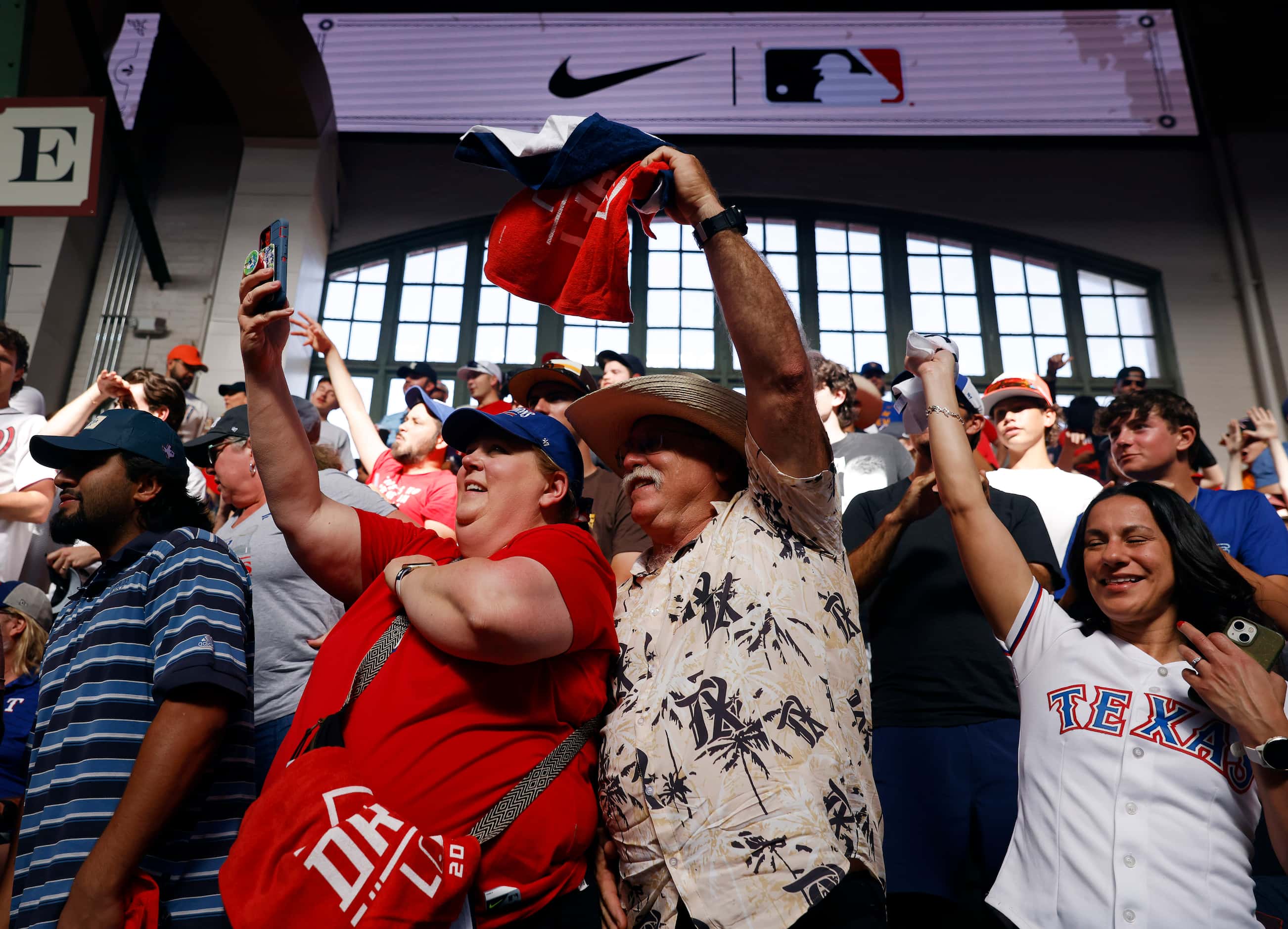 Texas Rangers fans Dona Kinney and her husband Ben of Keller cheer during Day 1 of the MLB...
