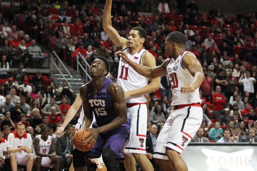 Feb 23, 2016; Lubbock, TX, USA; TCU Horned Frogs forward JD Miller (15) stops to take a shot...
