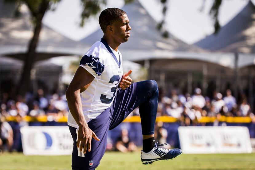 Dallas Cowboys cornerback Byron Jones stretches during a joint practice with the St. Louis...