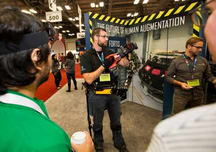 Gavin Barnes, a lead engineer at Lockheed Martin shows the Fortis exoskeleton at SXSW. 