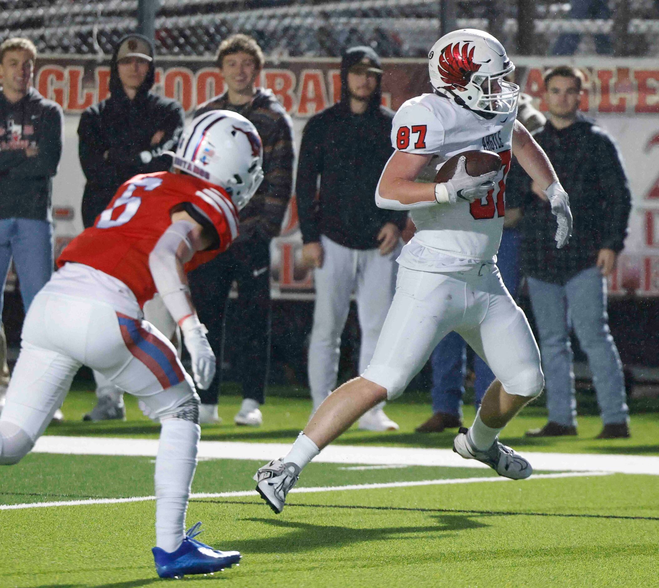 Argyle High’s Hunter McFaul (87), right, competes a touchdown past Grapevine’s Victor Deal...