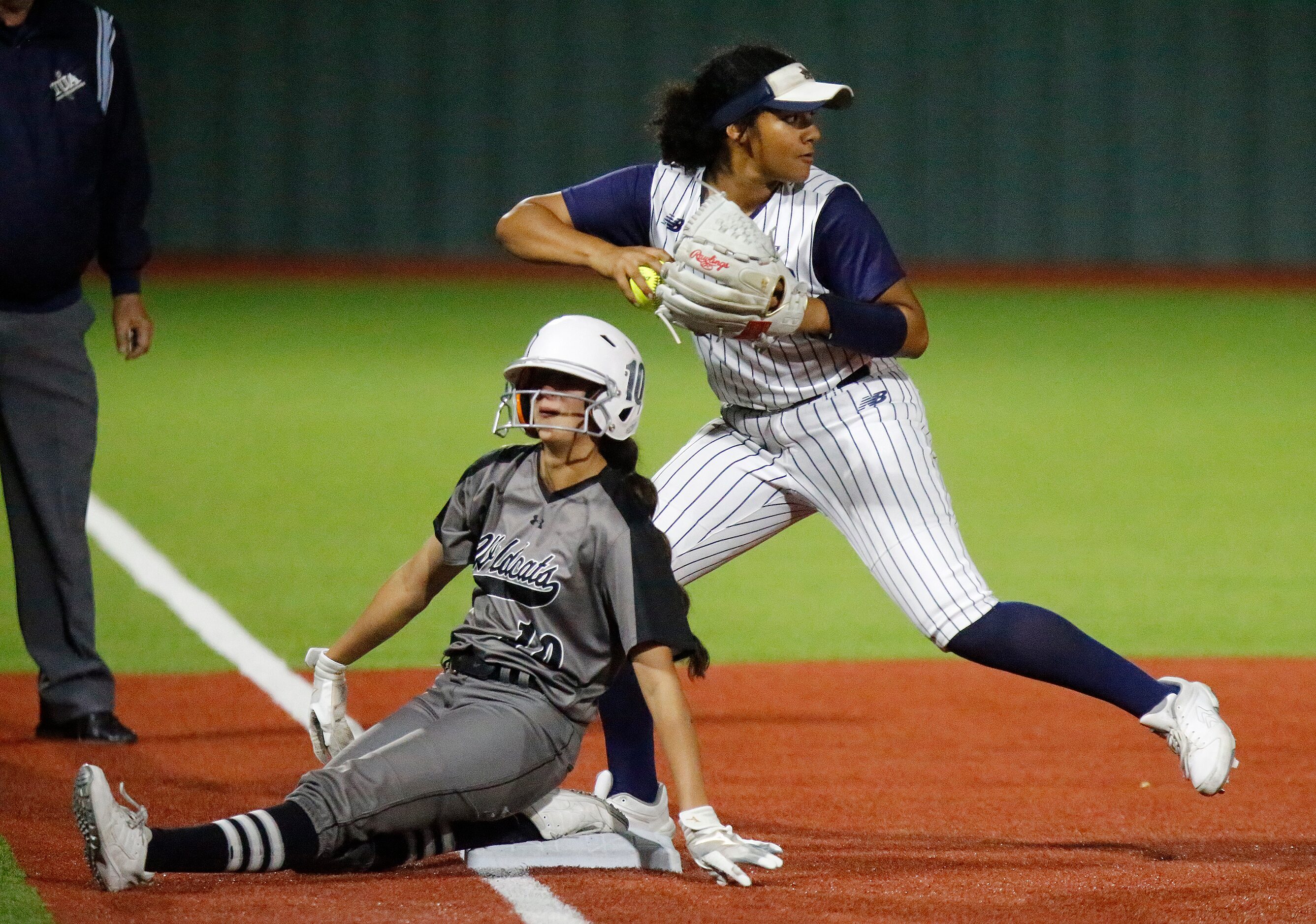 Denton Guyer High School first baseman Lilly Galaviz (10) slides safely into third base...