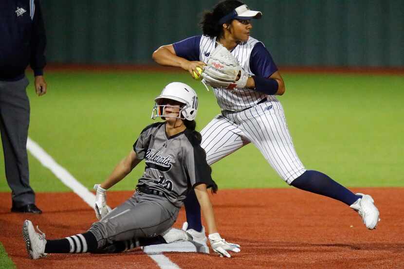 Denton Guyer High School first baseman Lilly Galaviz (10) slides safely into third base...