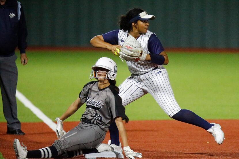 Denton Guyer High School first baseman Lilly Galaviz (10) slides safely into third base...