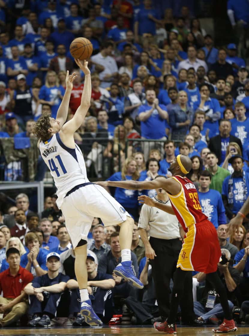 Dallas Mavericks forward Dirk Nowitzki (41) shoots a fadeaway jumper over Houston Rockets...