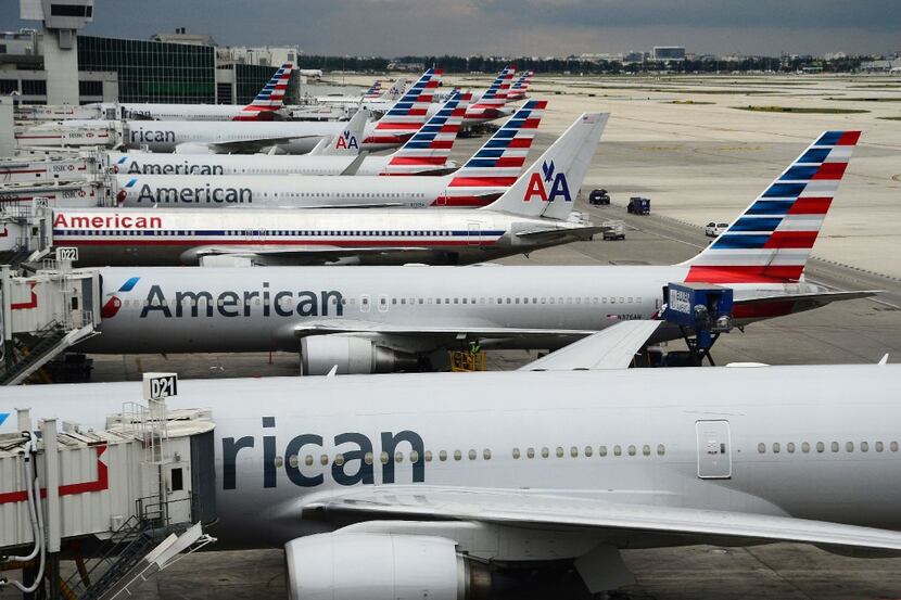 (FILES) This file photo taken on June 8, 2015 shows American Airlines passenger planes  on...