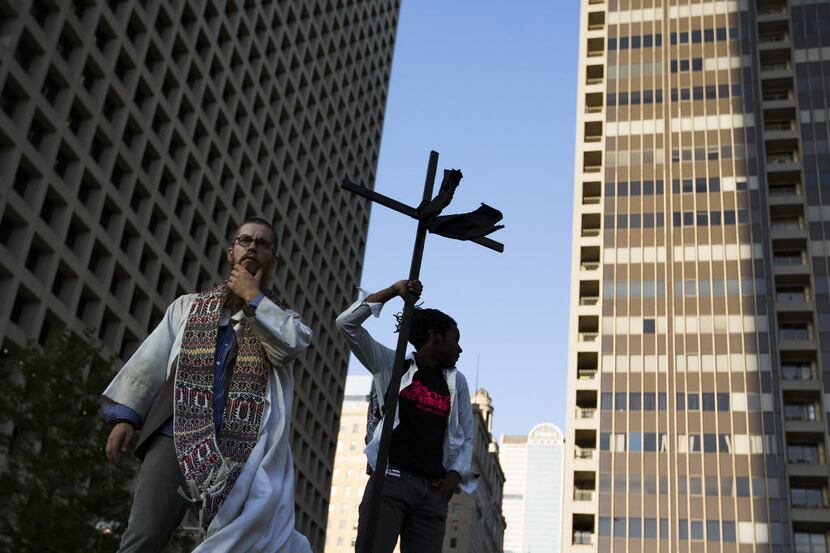 The Rev. Jeff Hood (left) and Christian Parks join protestors at a rally in downtown Dallas...