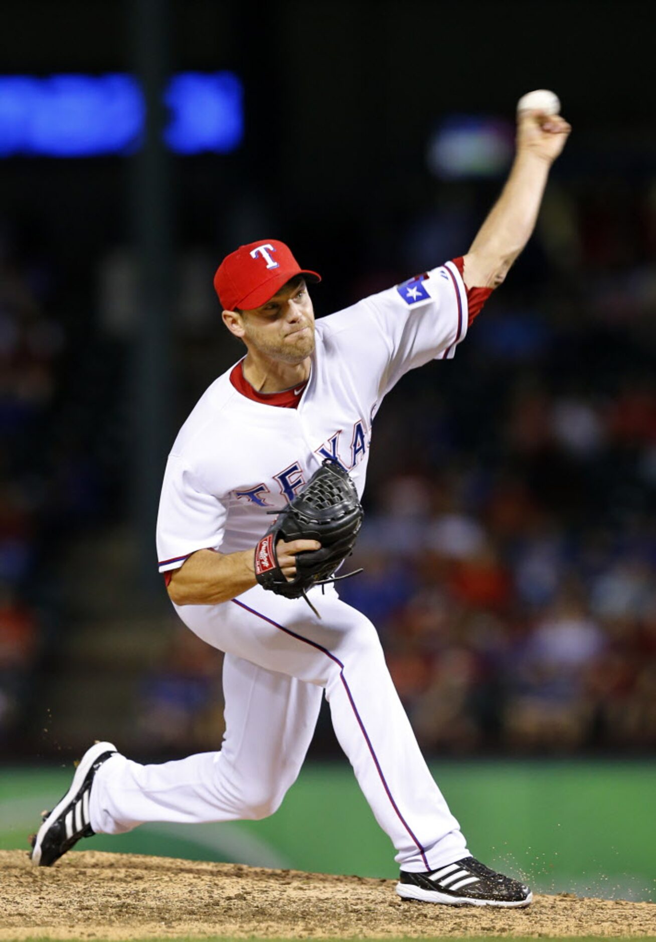 Texas Rangers relief pitcher Neal Cotts (56) throws in the eleventh inning against the...