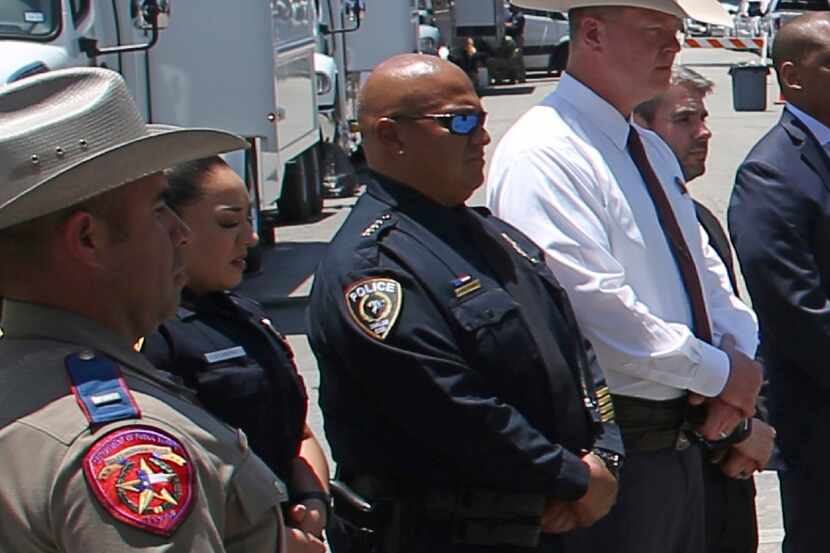 Uvalde school police Chief Pete Arredondo (third from left) stood during a news conference...
