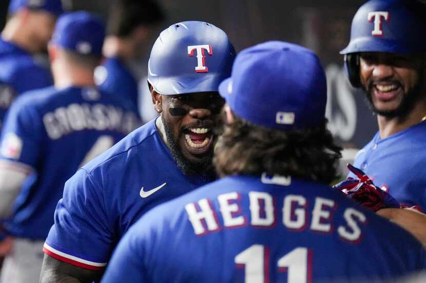 Texas Rangers right fielder Adolis Garcia (53) celebrates with Texas Rangers catcher Austin...