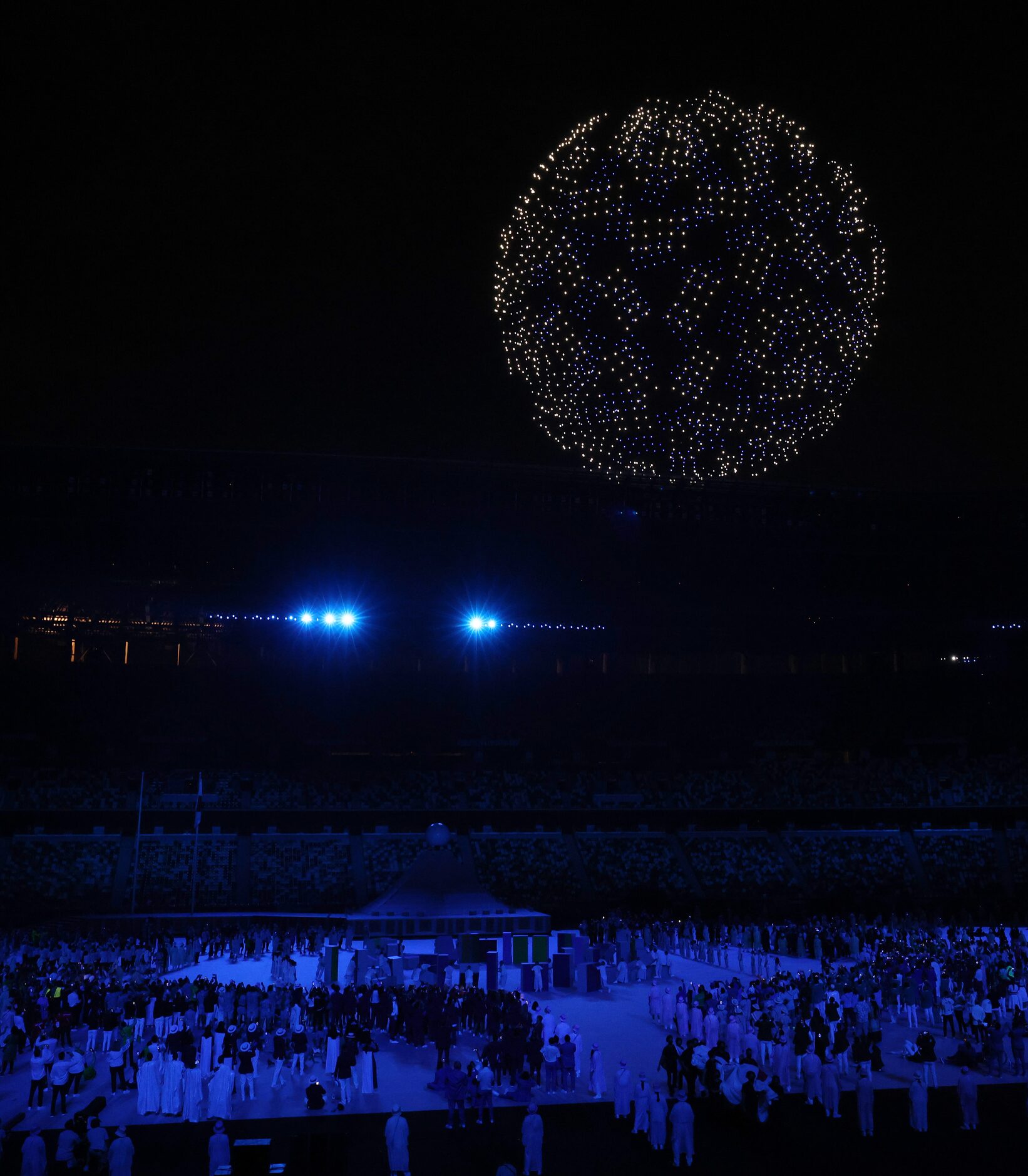 Drones make a formation during the opening ceremony for the postponed 2020 Tokyo Olympics at...