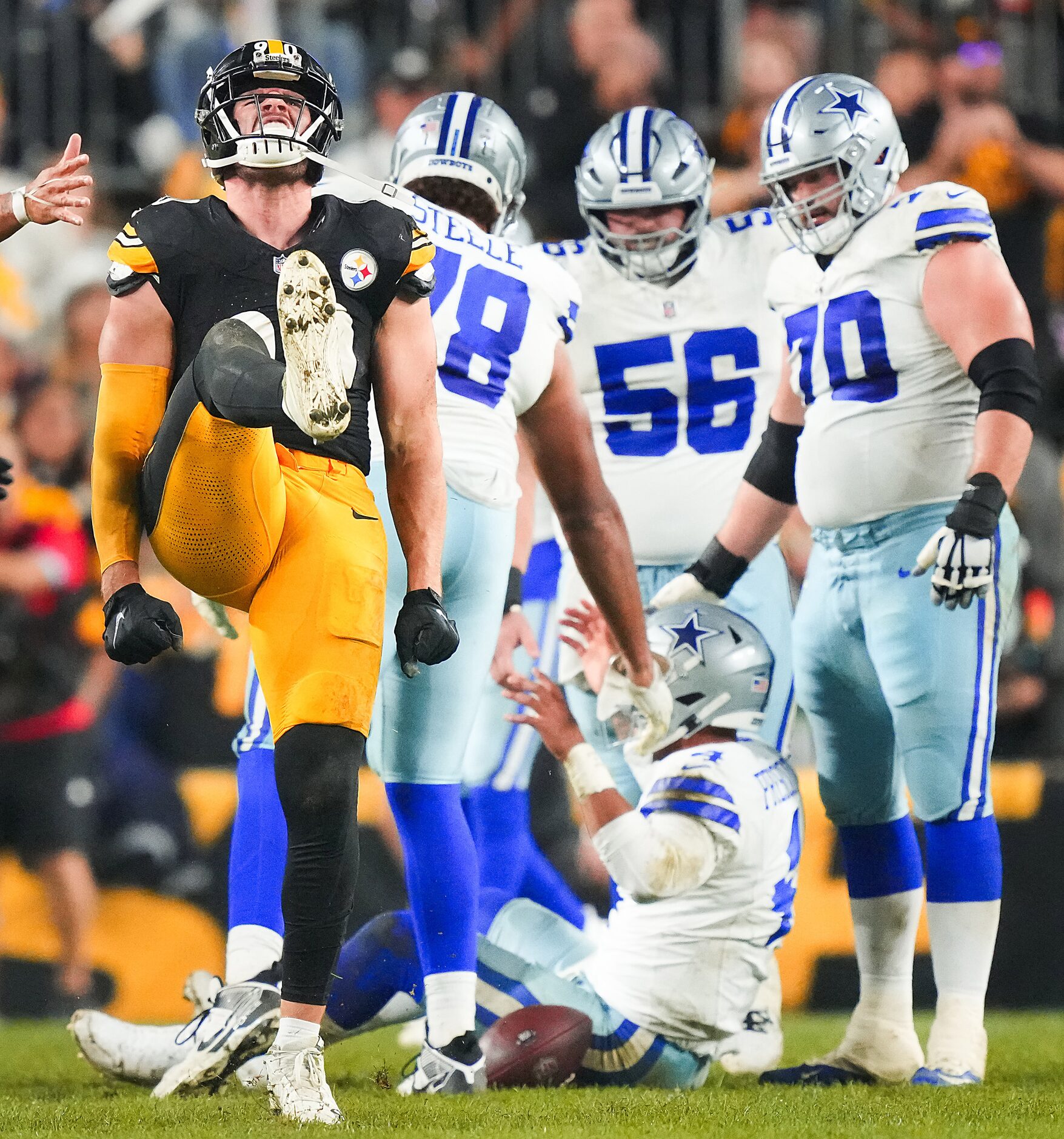 Pittsburgh Steelers linebacker T.J. Watt (90) celebrates after sacking Dallas Cowboys...