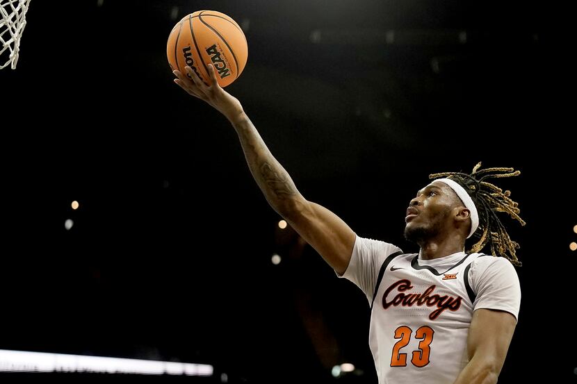 Oklahoma State forward Tyreek Smith puts up a shot during the second half of an NCAA college...
