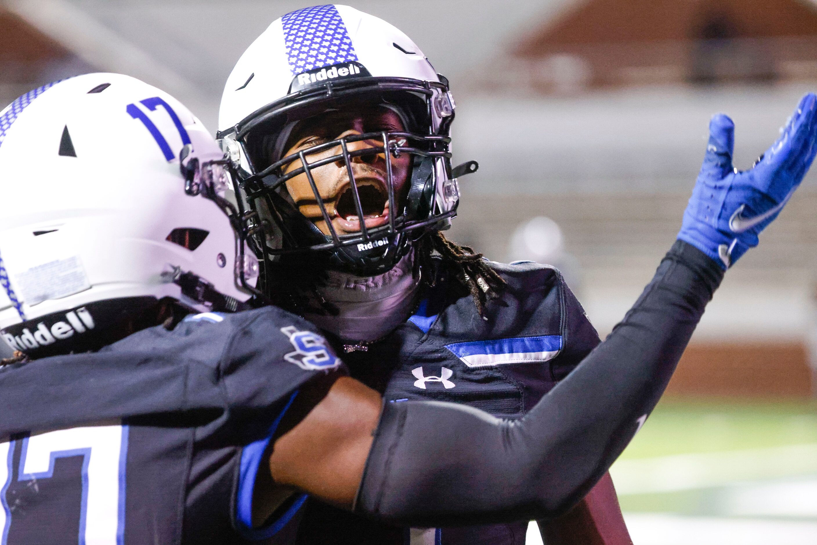 Mansfield Summit High’s John Williams (left) and Amare Burgess celebrate a touchdown against...