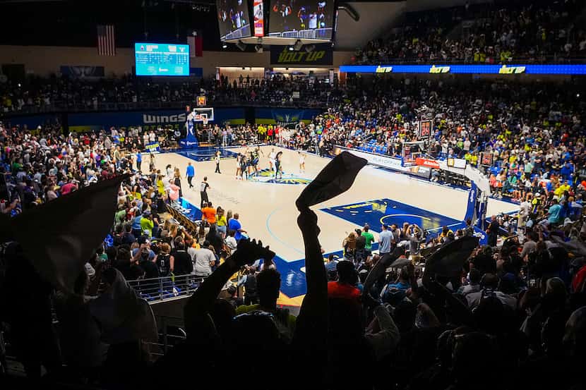 Dallas Wings fans cheer before the opening tipoff for Game 3 of a WNBA basketball semifinal...