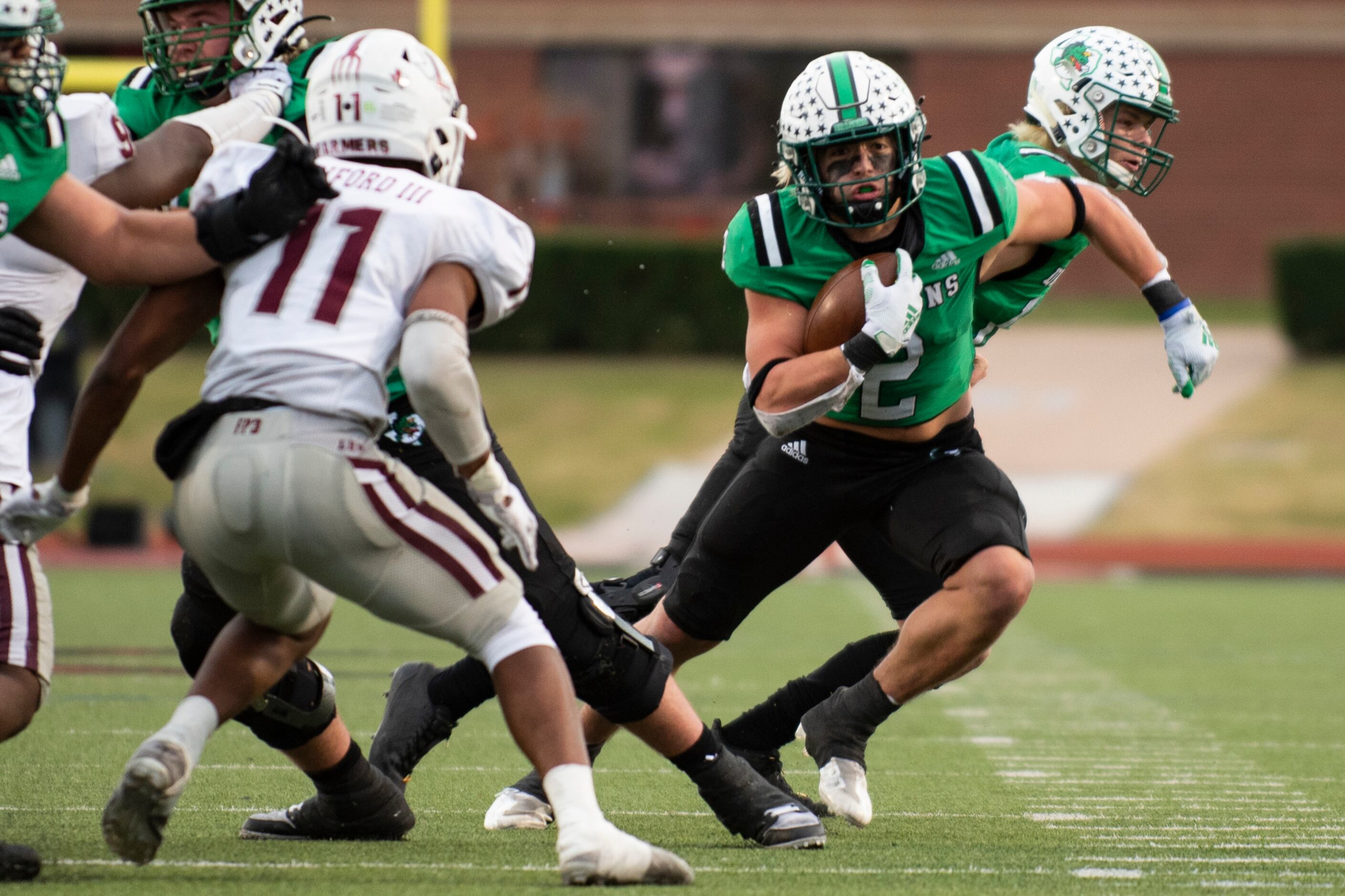 Southlake Carroll junior Owen Allen (2) rushes up the field to gain yardage during the Class...