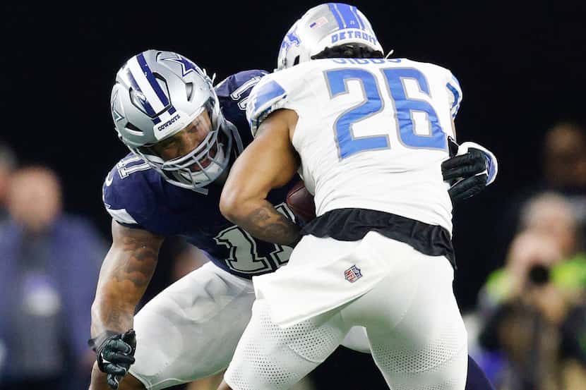 Dallas Cowboys linebacker Micah Parsons (11) tackles Detroit Lions running back Jahmyr Gibbs...