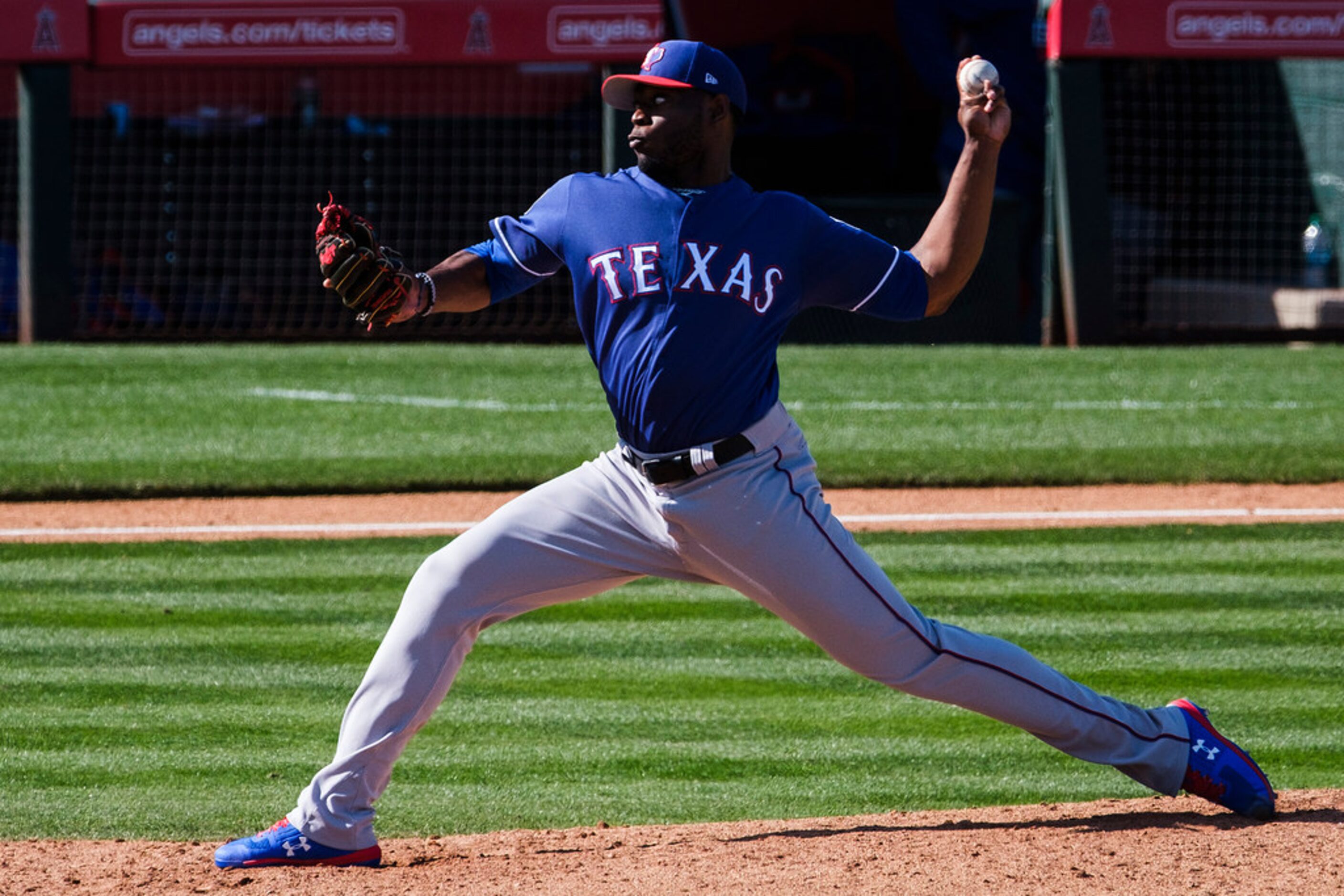 Texas Rangers pitcher CD Pelham pitches during the sixth inning of a spring training...