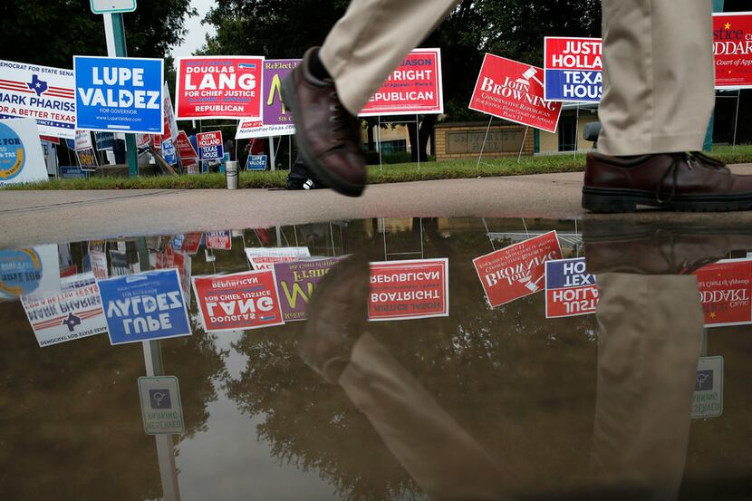 A voter makes their way back to their car after voting at a polling station at Collin...