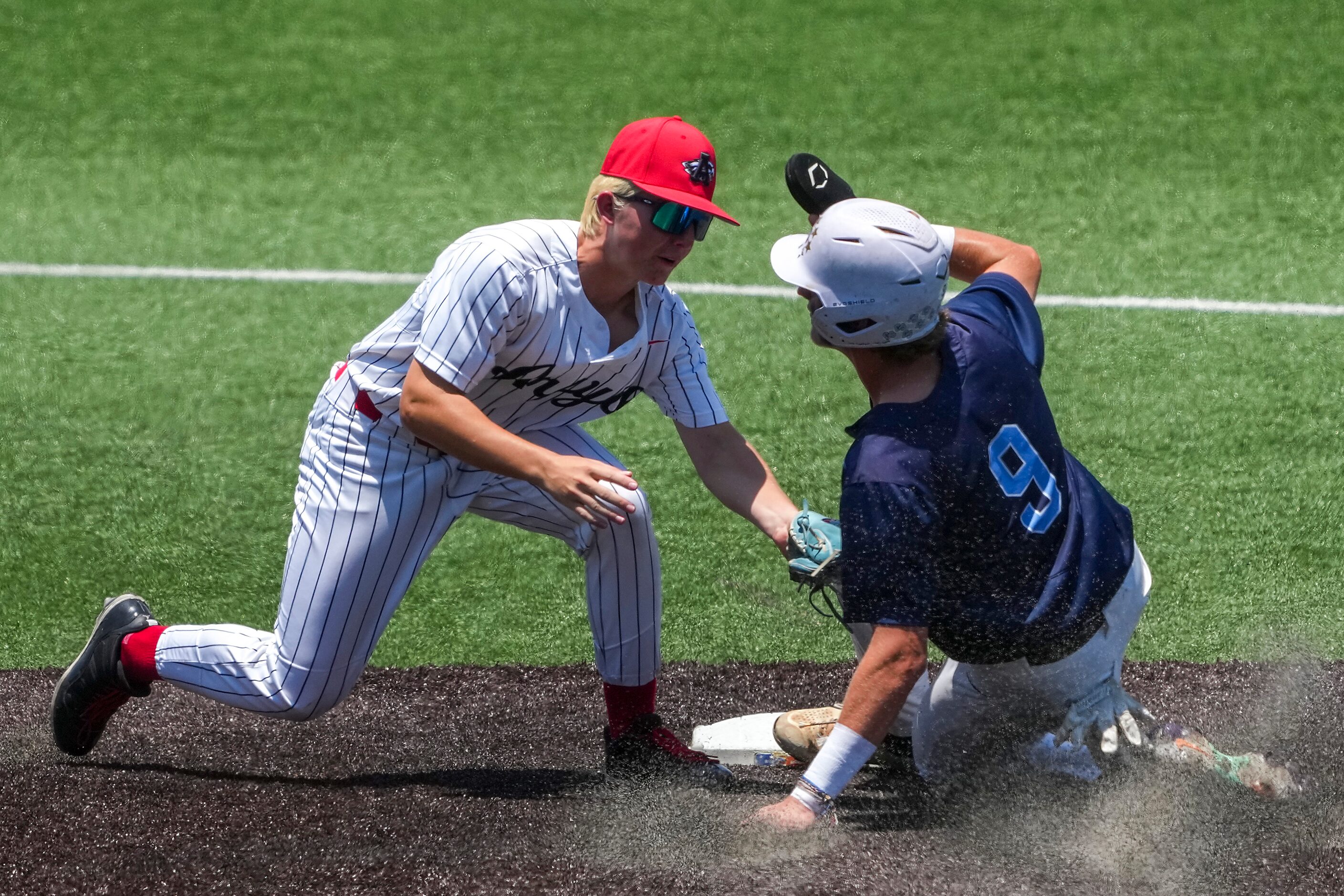 China Spring second baseman Cage McCloud (9) is caught stealing at second base on a tag from...