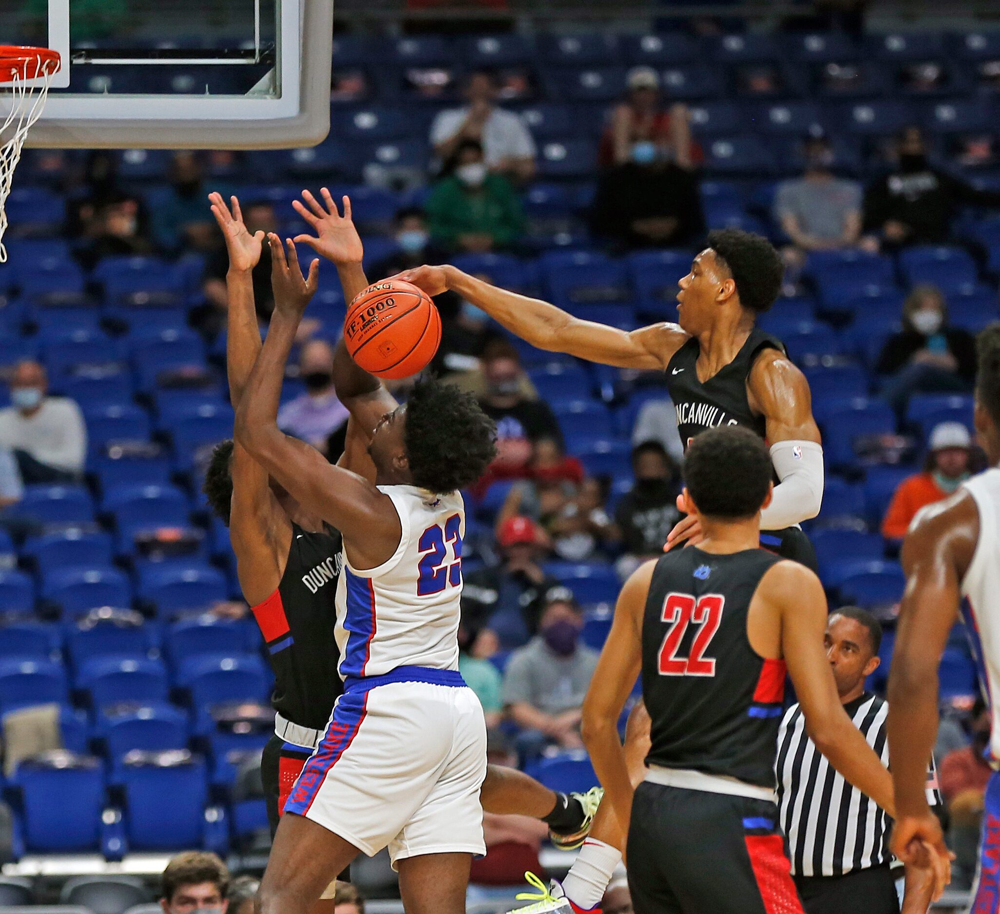 Duncanville Zhuric Phelps #0 blocks shot of Westlake Nehikhare Igiehon #23. UIL boys Class...