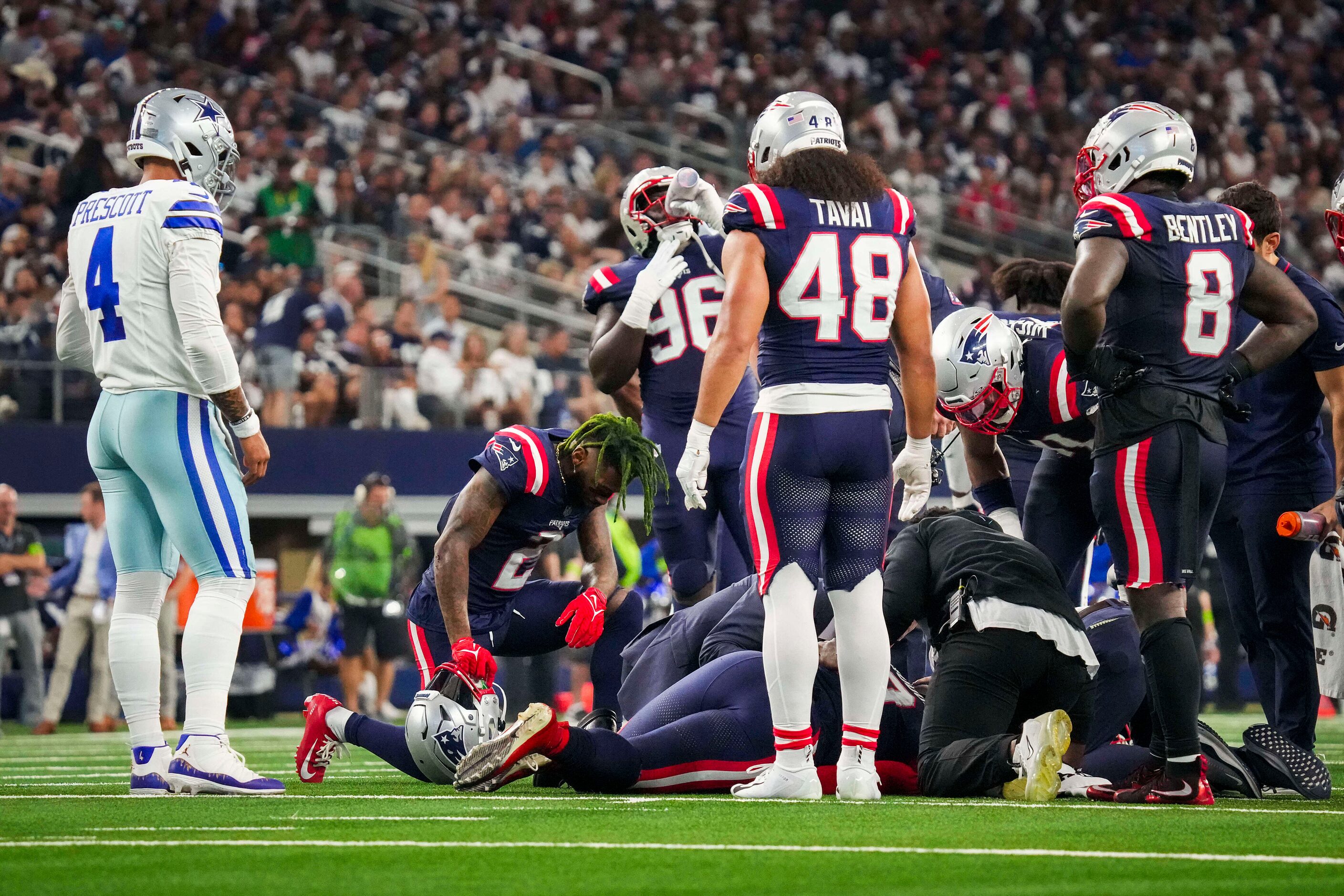 Dallas Cowboys quarterback Dak Prescott (4) looks on as New England Patriots linebacker...