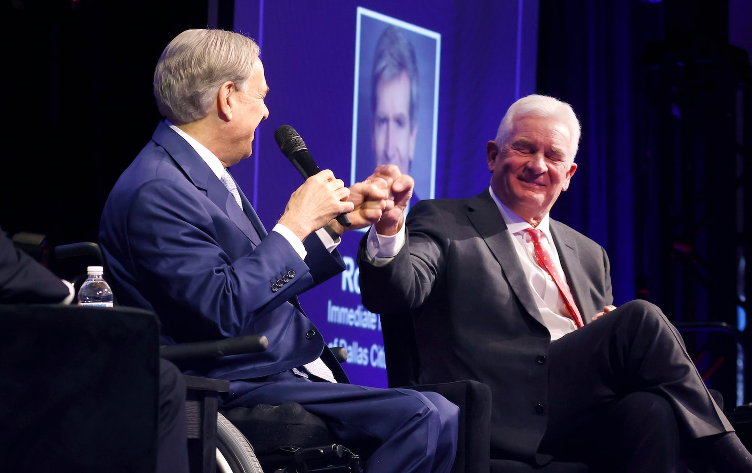 Texas Governor Greg Abbott (left) receives a first bump from Kelcy Warren, CEO of Energy...