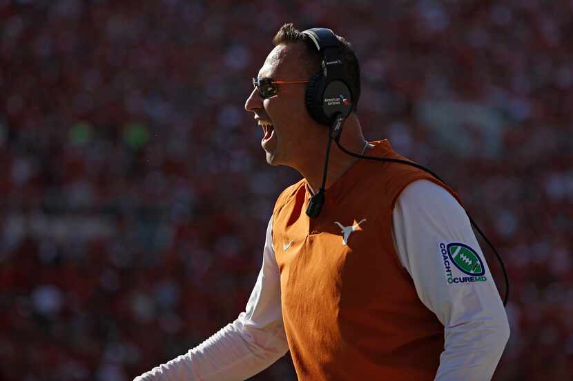 Texas coach Steve Sarkisian yells to his players during the second half of an NCAA college...