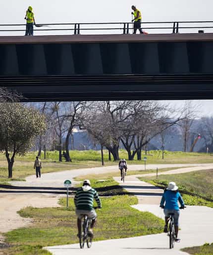 Cyclists and pedestrians on the Trinity Trails in Fort Worth