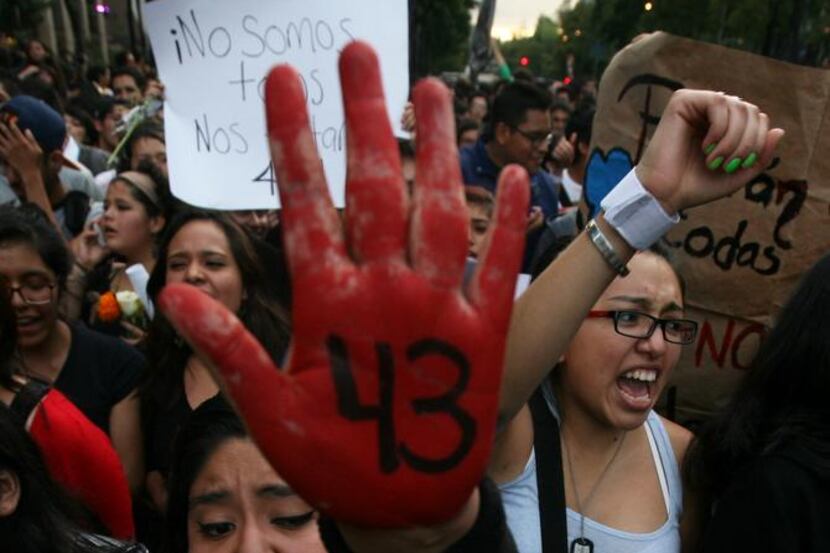 
In this Oct. 22 photo, people in Mexico City protest the disappearance of 43 students. 
