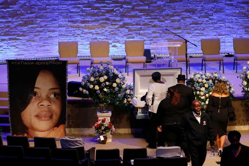 People mourn the loss of Atatiana Jefferson before the start of her funeral at Concord...