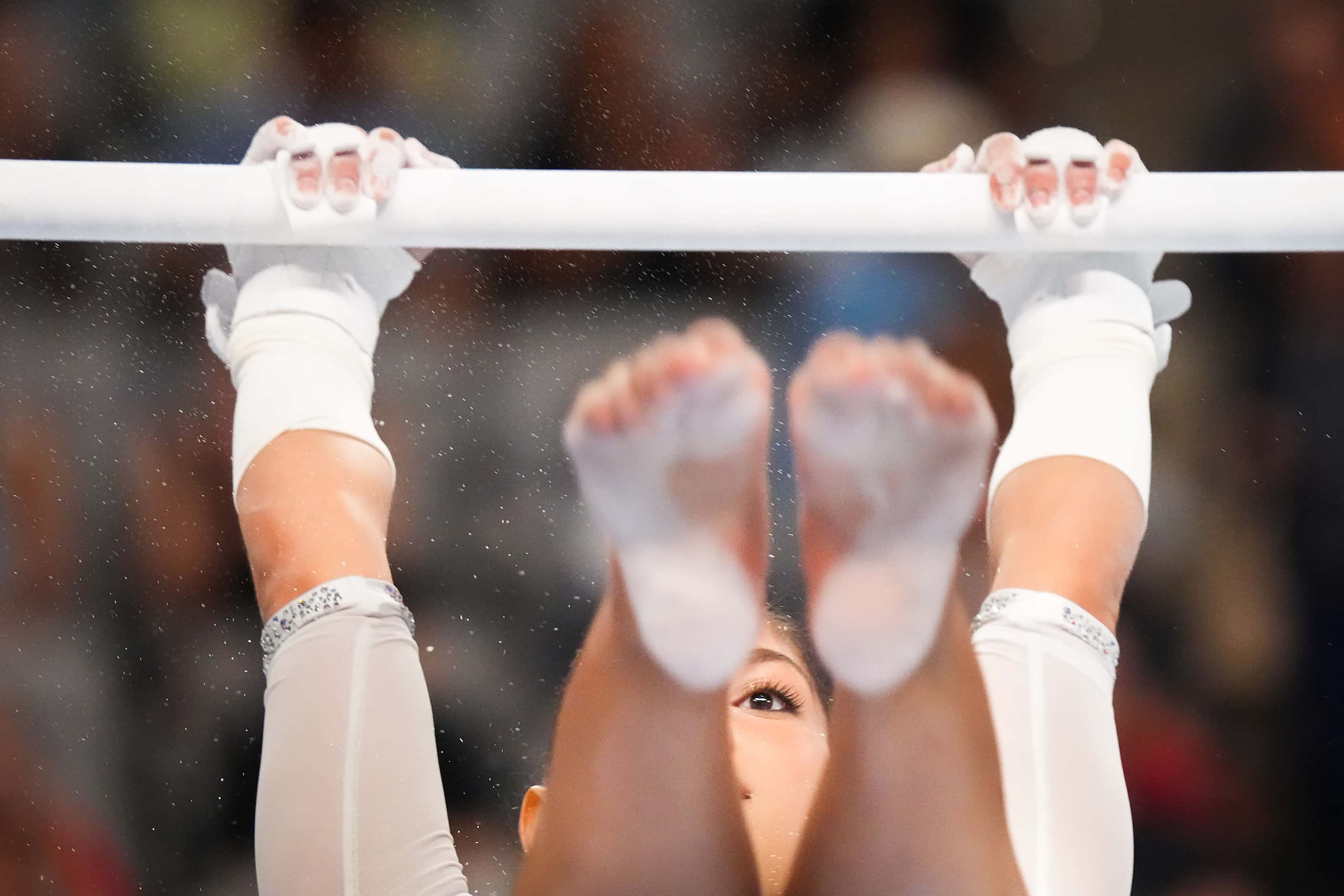 Madray Johnson competes on the uneven bars during the U.S. Gymnastics Championships on...