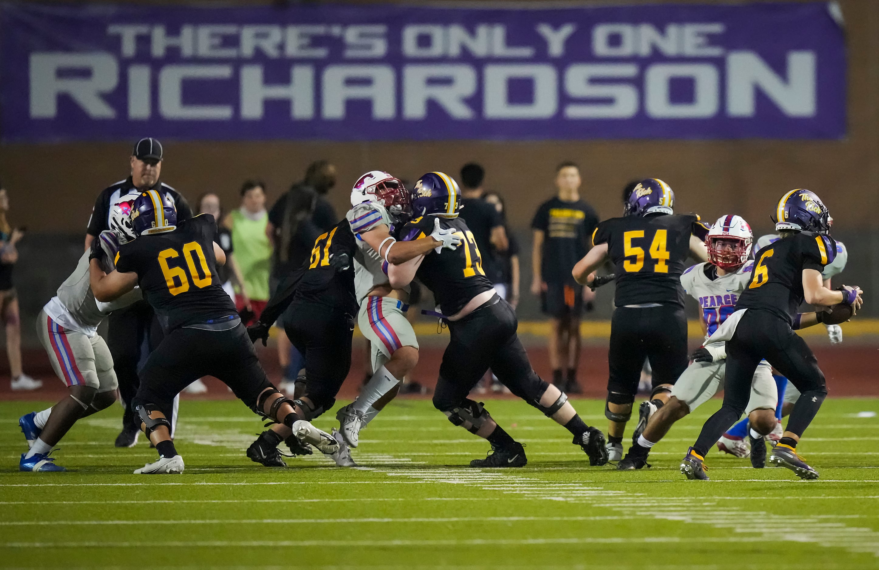 Richardson quarterback Cole Cage (6) scrambles away from the Richardson Pearce rush during...
