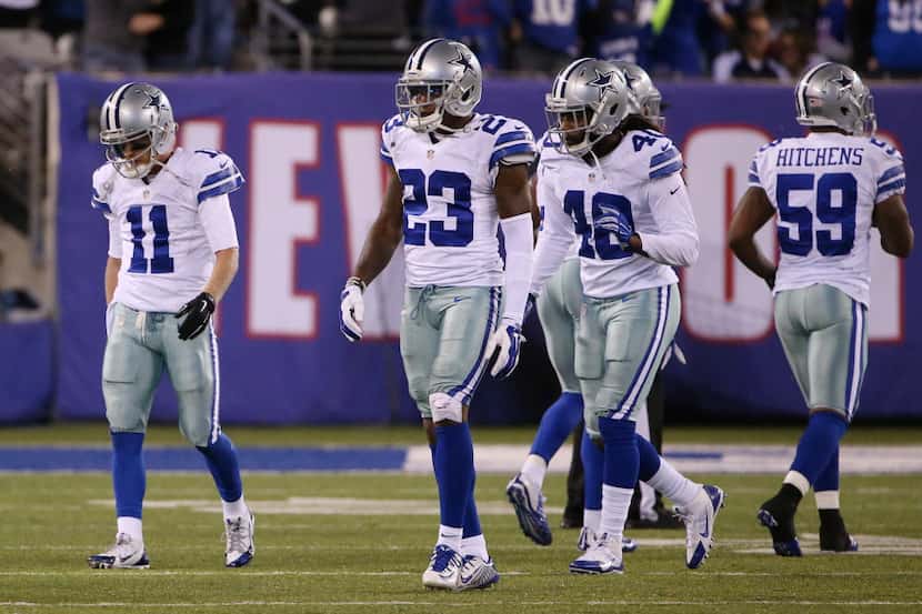 Dallas Cowboys wide receiver Cole Beasley (11) leaves the field dejected following a fumbled...