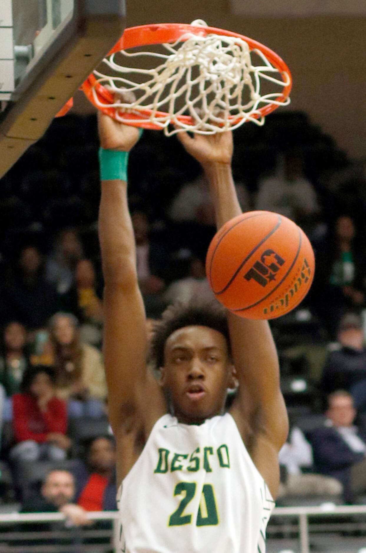 DeSoto's Christen Morgan (20) finishes a dunk during first half action against Richardson....