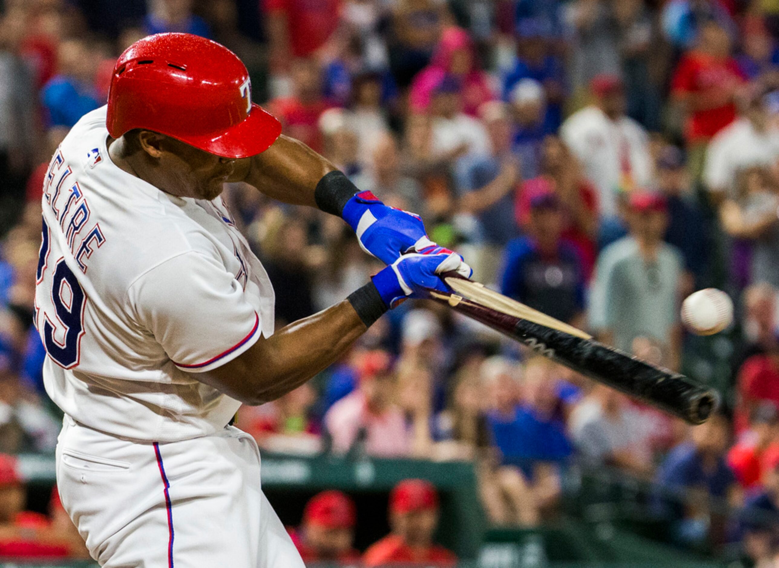 Texas Rangers third baseman Adrian Beltre (29) breaks a bat as he hits during the eighth...