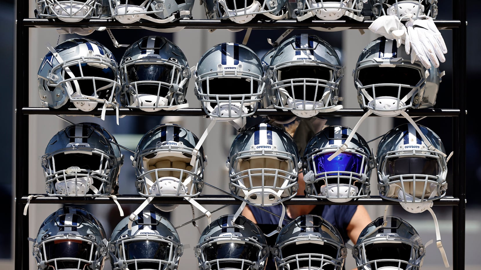 A rack of helmets are pictured following Training Camp practice at The Star in Frisco,...